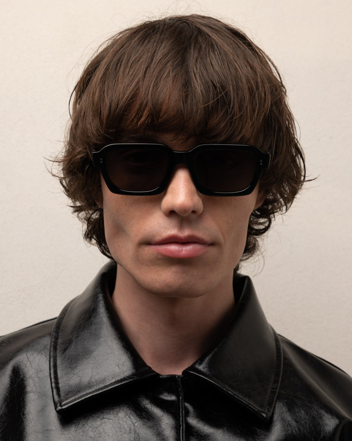Man wearing ME & JOE America black sunglasses – lifestyle view