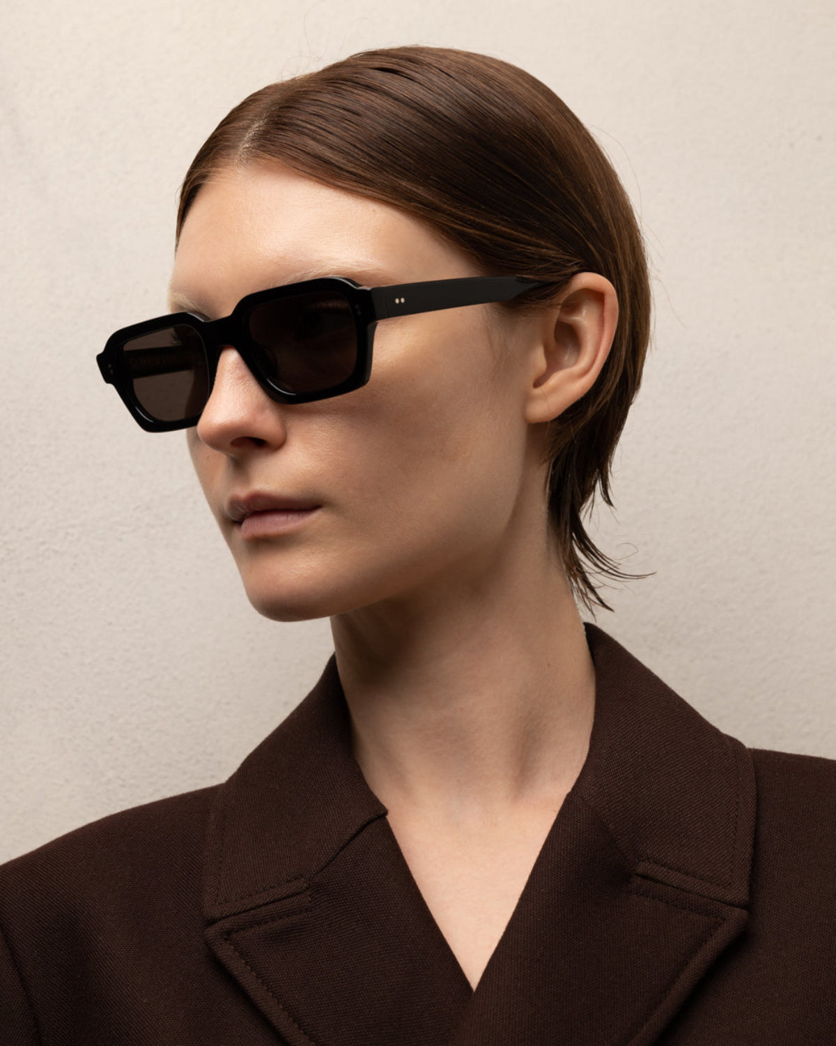 Woman wearing ME & JOE America black sunglasses – lifestyle view