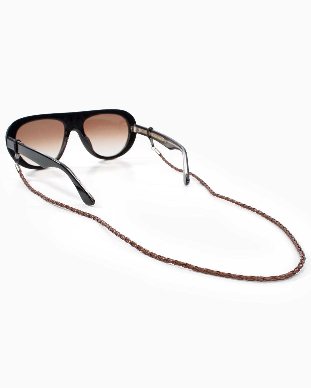 Rear view of brown braided eyewear chain attached to black sunglasses