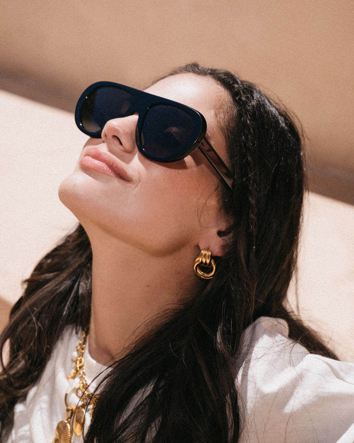 Woman wearing ME & JOE Riviera black sunglasses – editorial