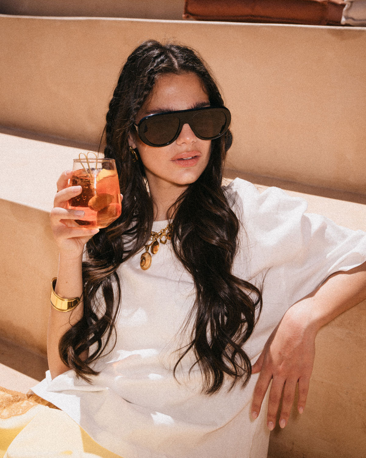 Woman wearing ME & JOE Riviera black sunglasses – editorial