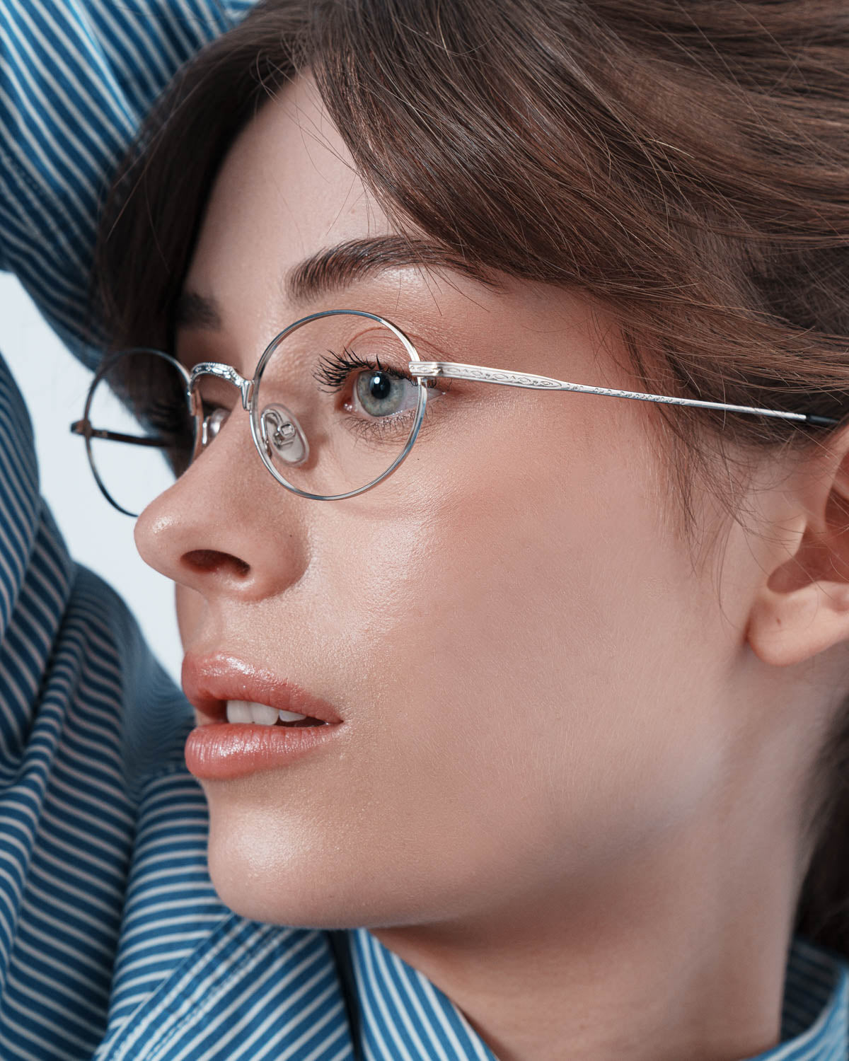 Woman wearing ME & JOE Soma silver optical glasses – three-quarter view