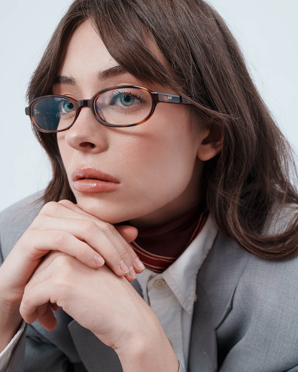 Woman wearing ME & JOE Iris tortoise optical glasses – three-quarter view