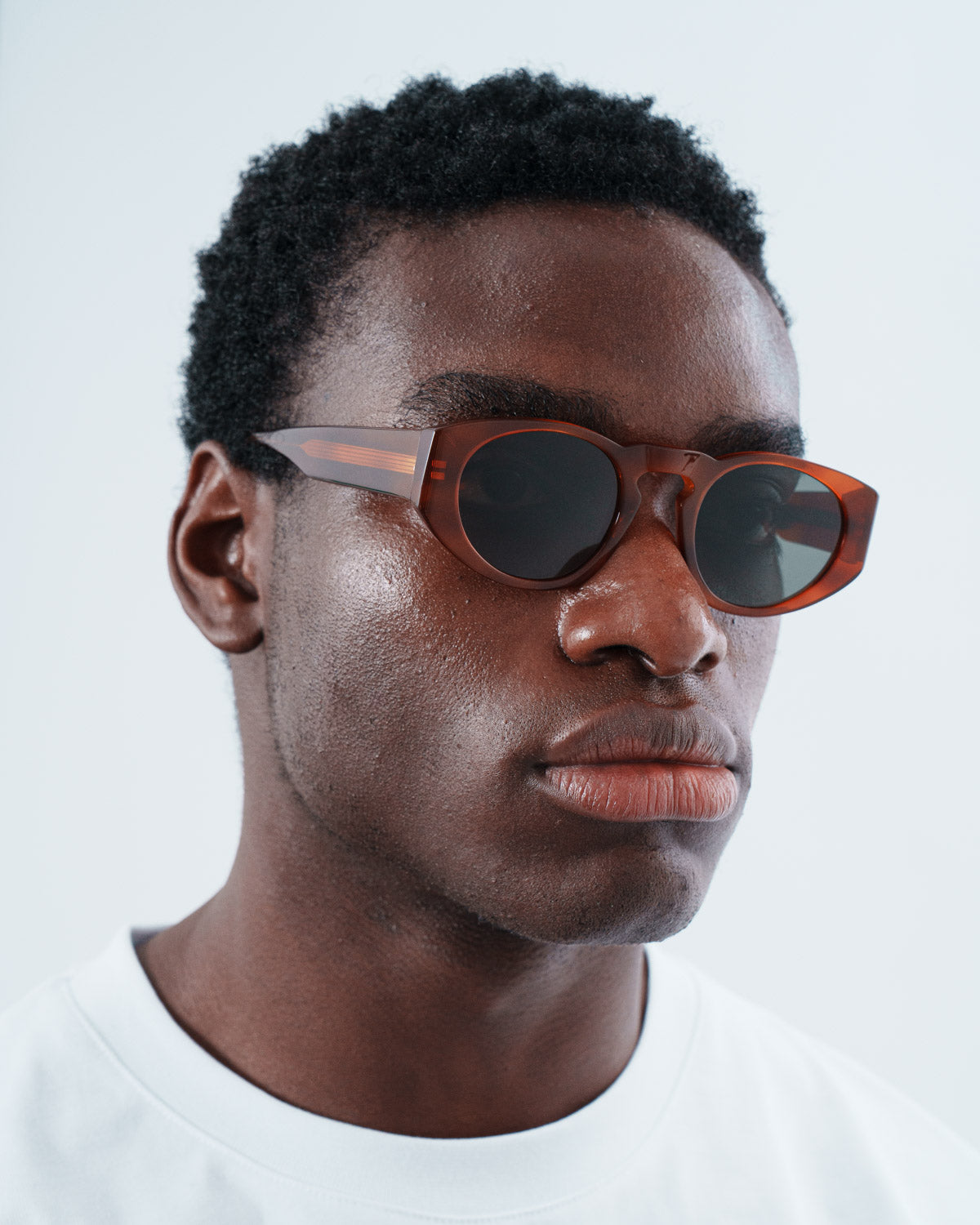 Man wearing ME & JOE Onassis tortoise sunglasses – hree-quarter view