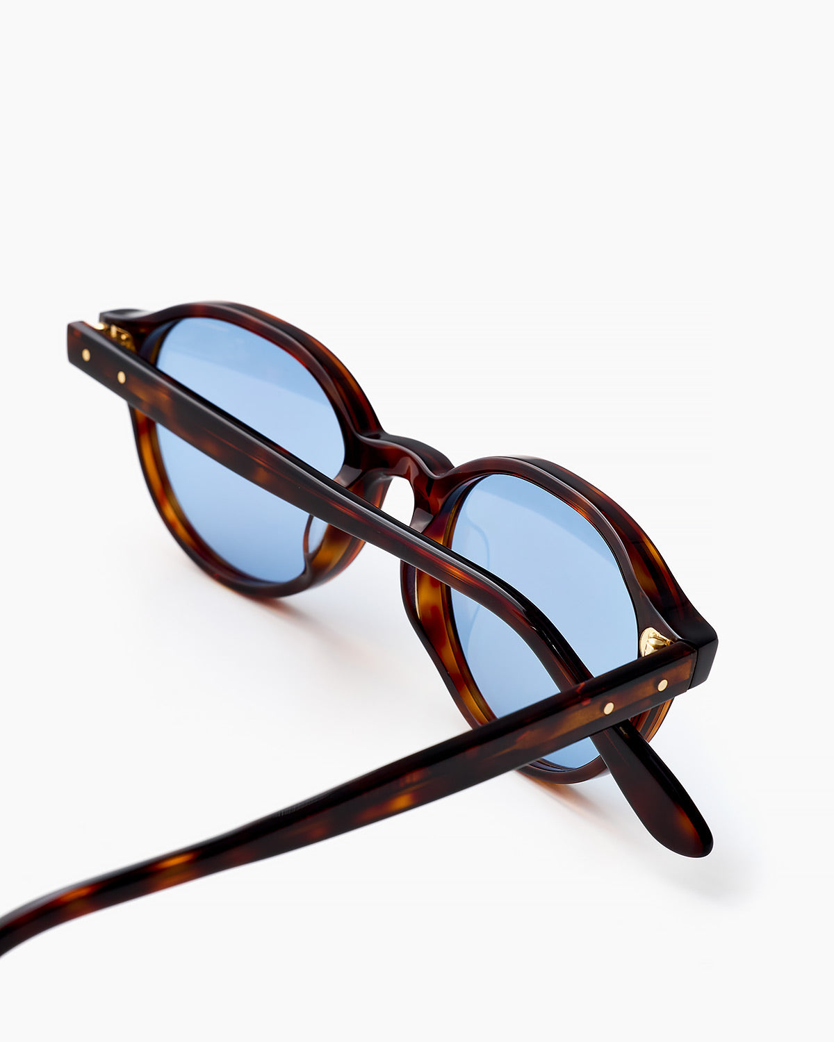 ME & JOE Bowie tortoise sunglasses with blue lenses – angled view
