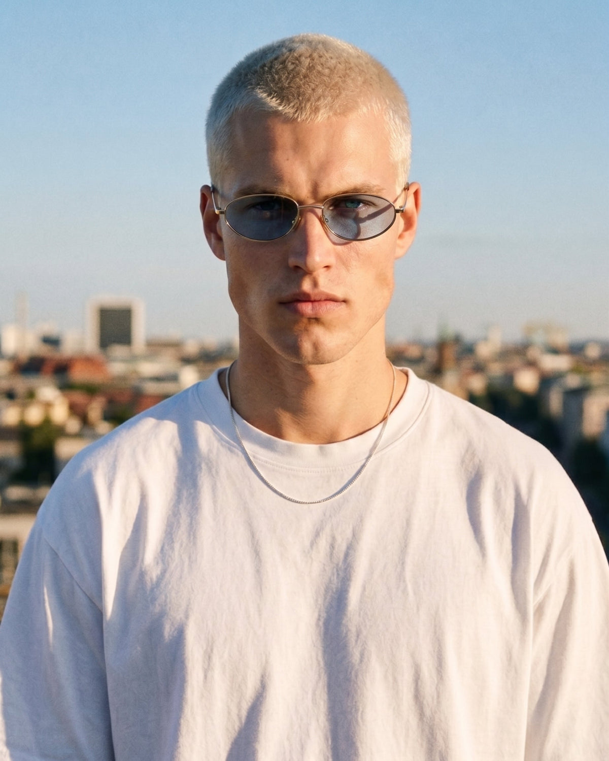 Noma Gold sunglasses with blue lenses by ME & JOE worn on male 