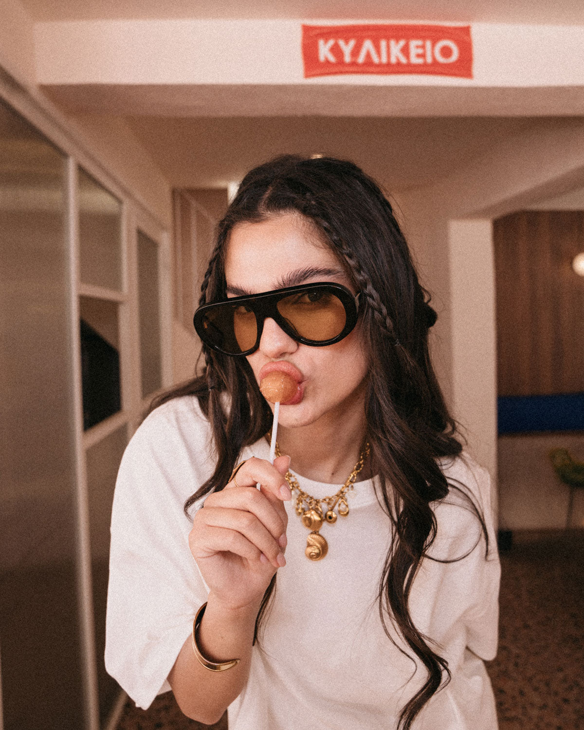 Woman wearing ME & JOE Riviera tortoise sunglasses with Amber lenses – lifestyle view