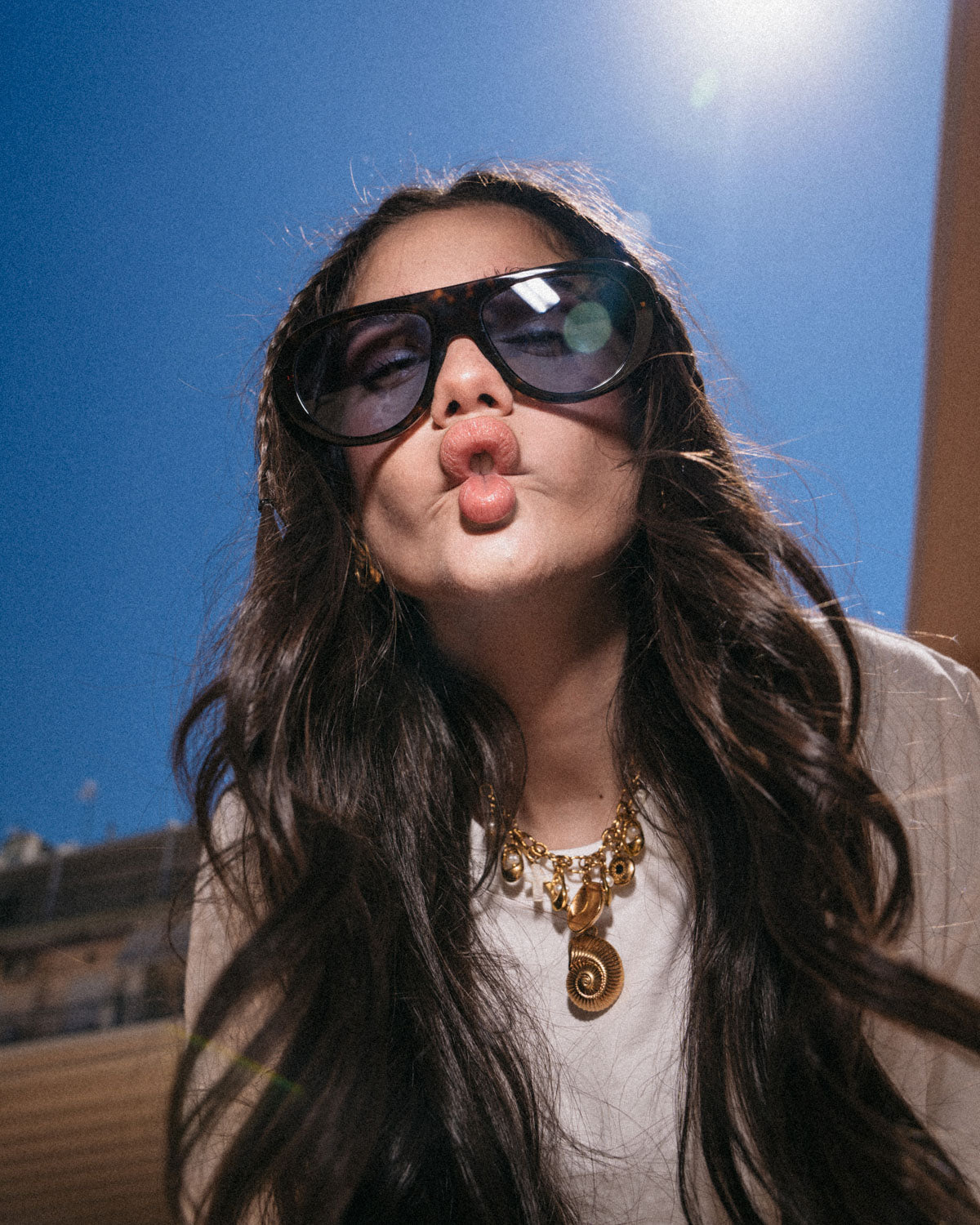 Woman wearing ME & JOE Riviera tortoise sunglasses with light blue lenses –lifestyle view