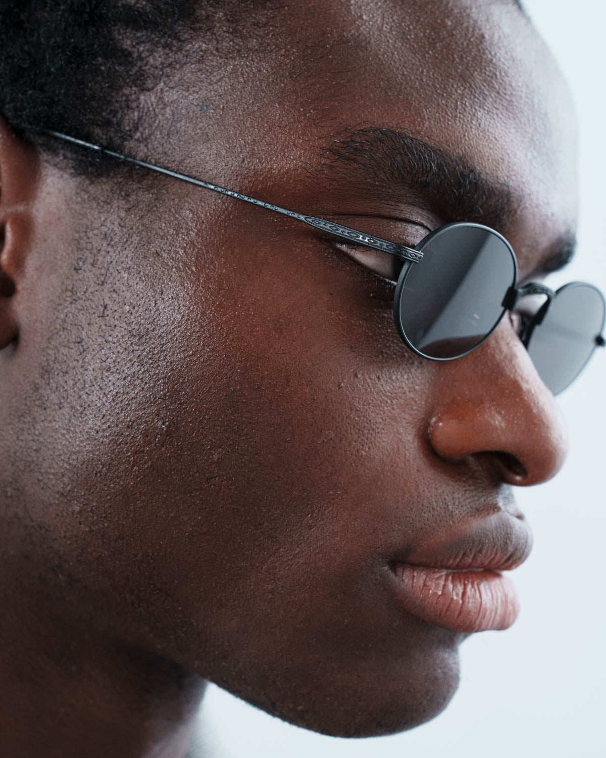 Man wearing ME & JOE soma black sunglasses –three-quarter view