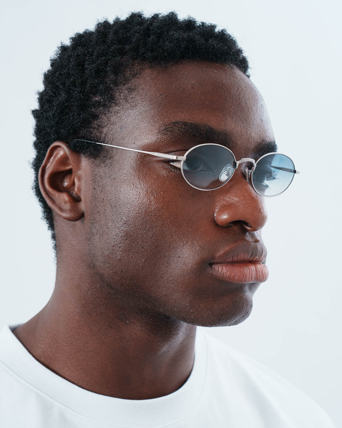 Man wearing ME & JOE Soma silver sunglasses – three-quarter view