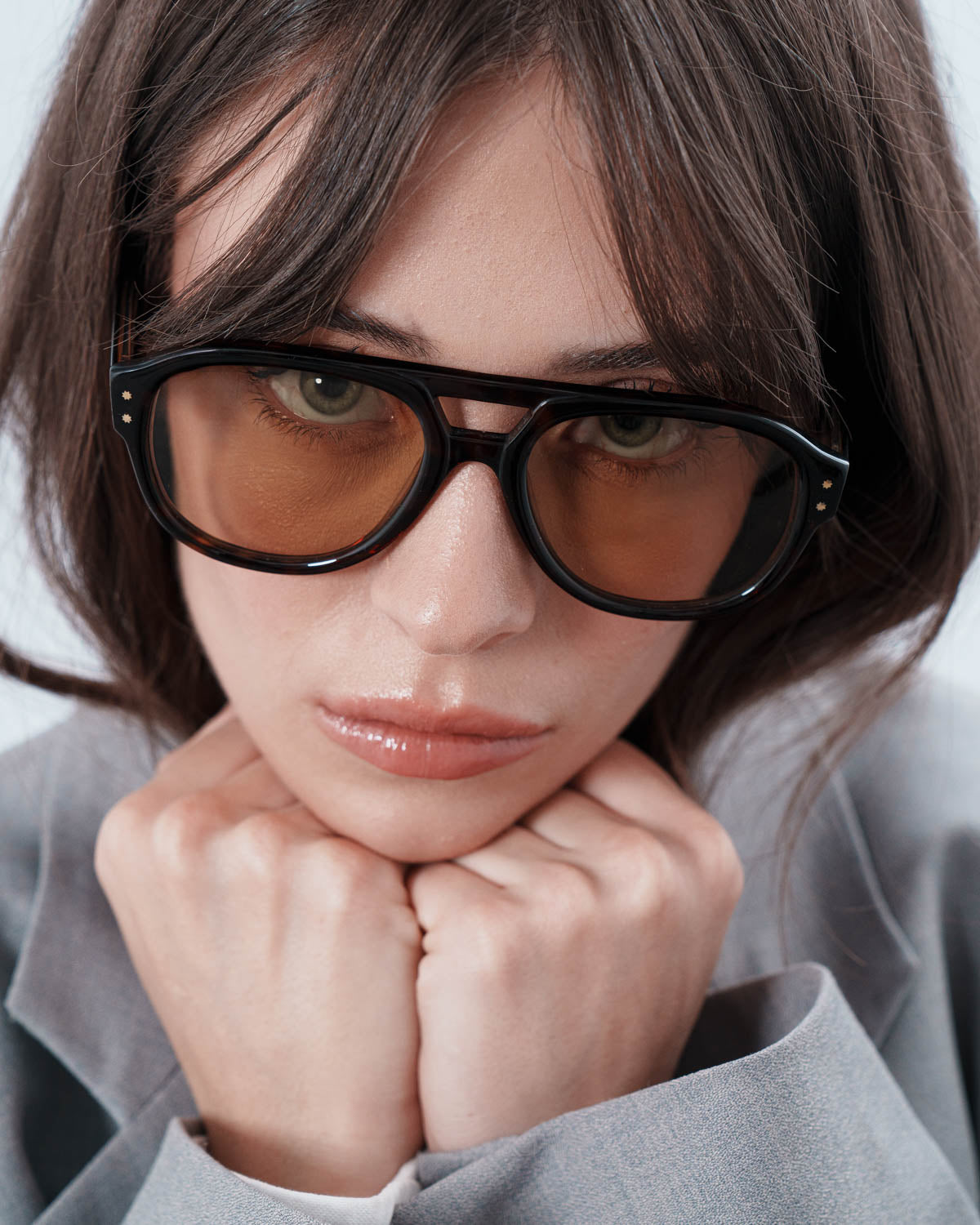 Woman wearing ME & JOE Ezra black sunglasses – close-up view