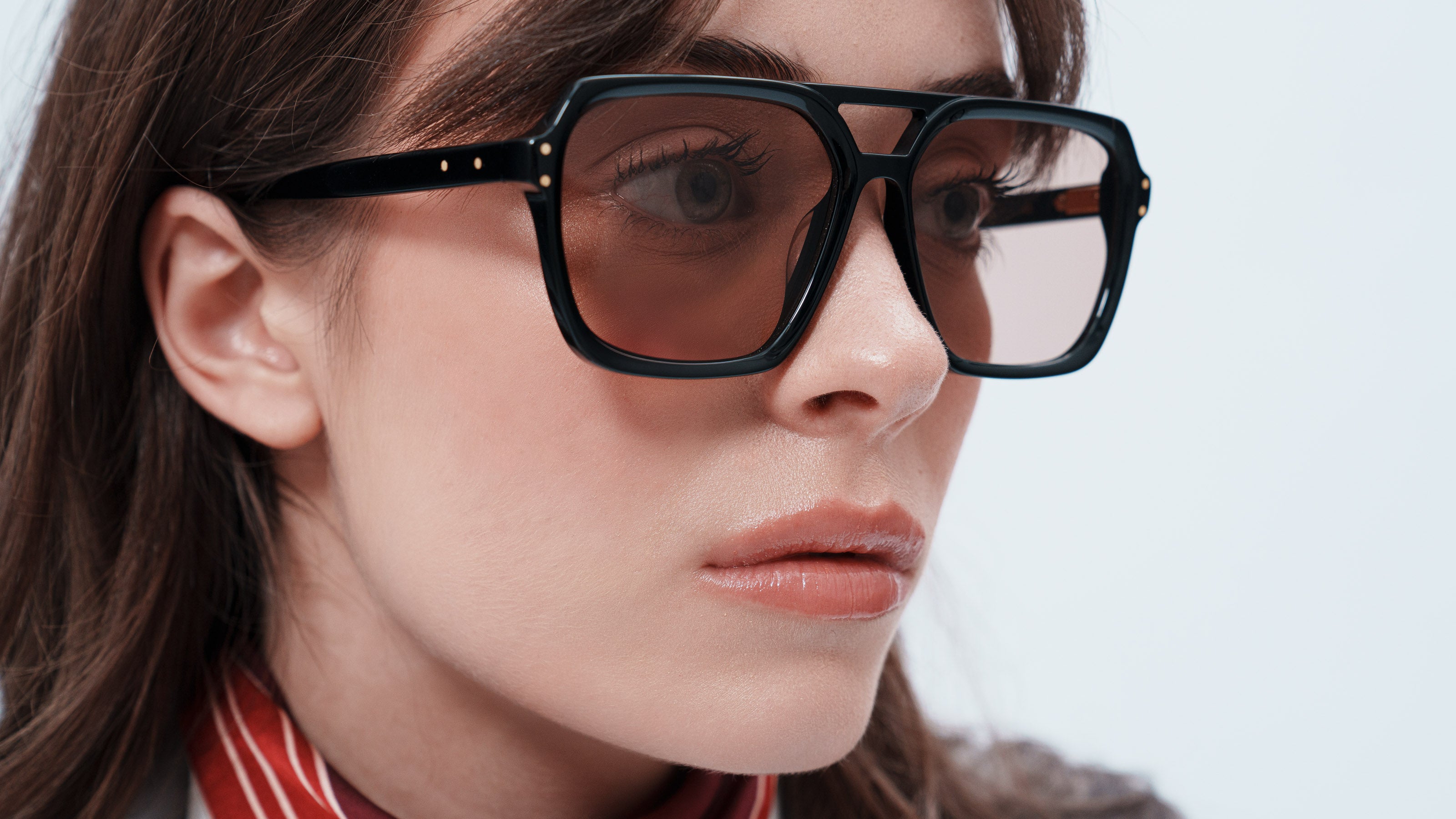 Woman wearing ME & JOE Madison black sunglasses – close-up view