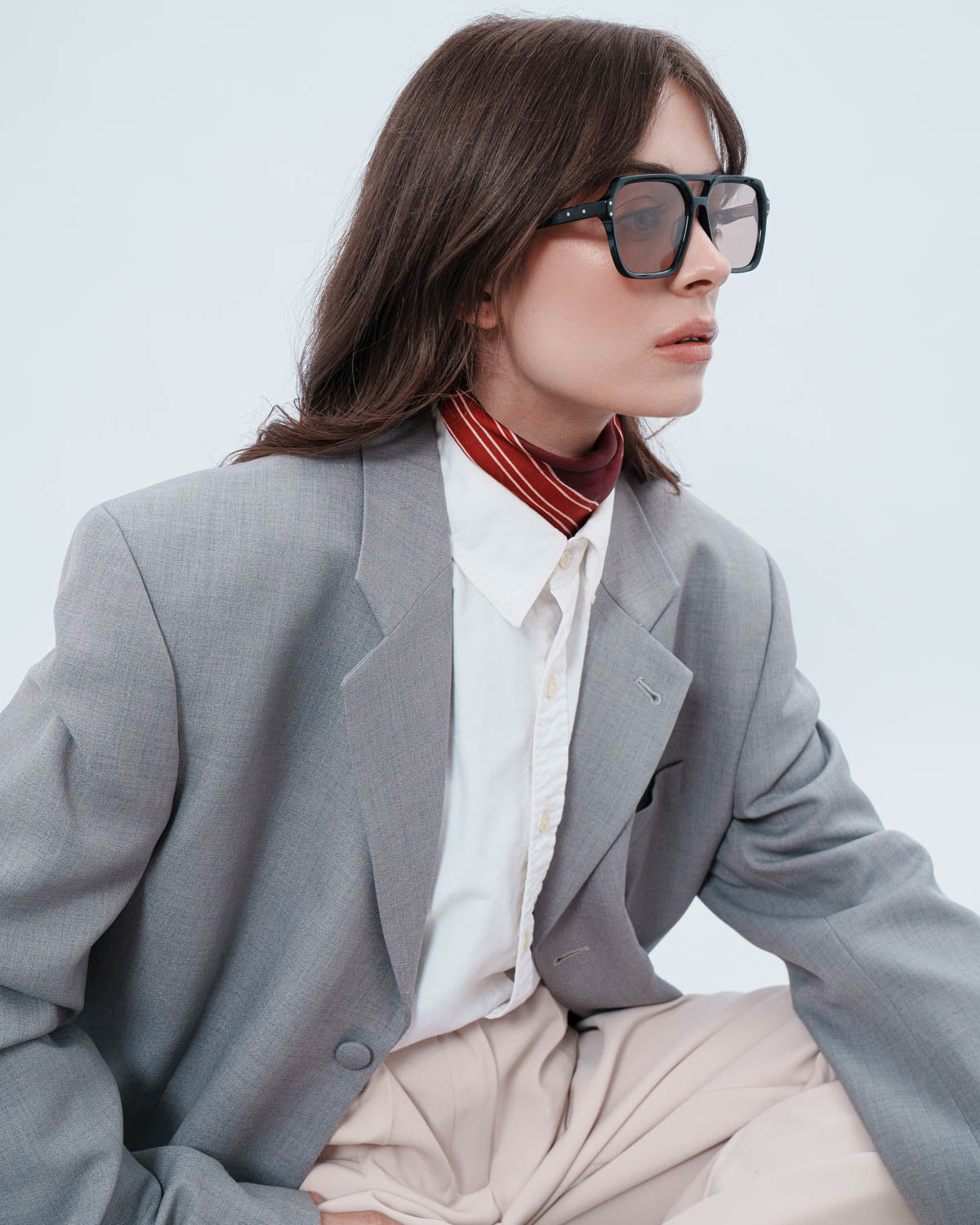 Woman wearing ME & JOE Madison black sunglasses – editorial view