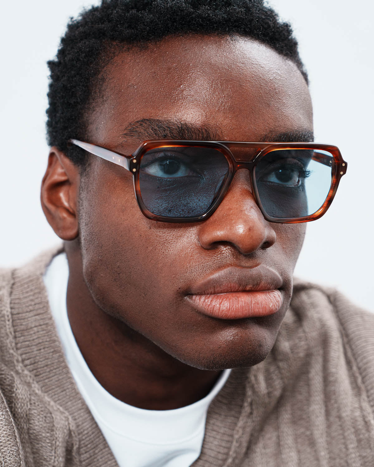 Woman wearing ME & JOE Madison tortoise sunglasses – close-up view